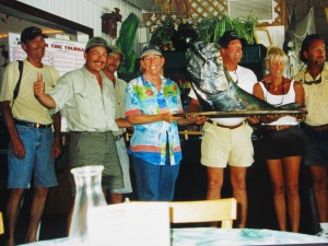 People holding 2002 1st Place, Millers Catch the King Tarpon Fishing Tournament