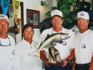 People holding Florida Flats Fishing and Tarpon Fishing Tournament award