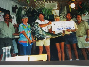People holding 2002 1st Place Millers Marina Weekly Tarpon Tide Tournament